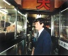 Leo Rubinfien / A Businessman in a Pet Store, Shinjuku, Tokyo, from the portfolio Map of the East / 1979-1987