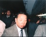 Leo Rubinfien / A Man in a Western Suit, Ameyoko Alley, Ueno, Tokyo, from the portfolio Map of the East / 1979-1987