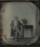 Unidentified Photographer / Portrait of a man at a table / 1840