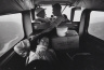 Cornell Capa / Untitled [three people in  airplane] / 20th  century