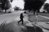 Wing Young Huie / Hmong Man Playing the Kheng,  Frogtown / 1994