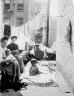 Lewis W. Hine / N.Y. tenement family gets fresh air on a hot day / ca. 1910