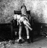 Ralph Eugene Meatyard / Boy with doll and flag / 1959