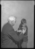Lewis W. Hine / Doctor Innoculates Boy / ca. 1909-1935