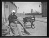 Lewis W. Hine / Old Woman Mending Bags In View Of The Cathedral Of Orleans France / n.d.