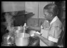 Lewis W. Hine / Woman cooking / ca. 1906-1938