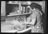 Lewis W. Hine / Woman Washing Dishes / ca. 1922-1938