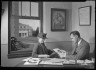 Lewis W. Hine / Man and Woman Viewing Photographs / ca. 1905-1940