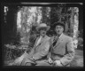 Arnold Genthe / Sterling, George, Mr., and an unidentified man, seated outdoors / between 1906 and 1914