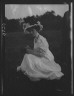 Arnold Genthe / Rainsford, Mrs., seated outdoors / between 1922 and 1924