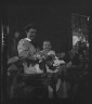 Arnold Genthe / Unidentified woman and baby, seated on porch / between 1911 and 1942