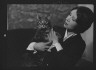 Arnold Genthe / Cumner, Gwendolyn, Miss, with cat (possibly Pudge), portrait photograph / 1928