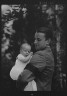 Arnold Genthe / Brady, James Cox, Jr., Mr., and child, outdoors / 1930 May 24