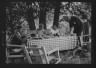 Arnold Genthe / Nyland group, eating outdoors / 1932