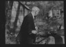 Arnold Genthe / Sexton, Mr., standing outdoors / between 1932 and 1936