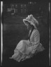 Arnold Genthe / Rainsford, Mrs., seated outdoors / between 1922 and 1924