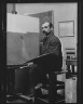 Arnold Genthe / Unidentified man, seated at his easel, portrait photograph / between 1896 and 1942