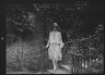 Arnold Genthe / Unidentified woman, standing outdoors / between 1896 and 1942