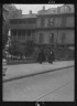 Arnold Genthe / Two nuns walking down Royal Street behind the St. Louis Cathedral, New Orleans / between 1920 and 1926