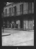 Arnold Genthe / People standing by the doorway of a furniture shop in the French Quarter, New Orleans / between 1920 and 1926