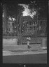 Arnold Genthe / Child walking past a gate, New Orleans or Charleston, South Carolina / between 1920 and 1926