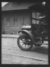 Arnold Genthe / Car driving down a street, New Orleans or Charleston, South Carolina / between 1920 and 1926