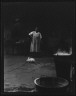 Arnold Genthe / Woman and rabbit in a courtyard, New Orleans / between 1920 and 1926