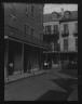 Arnold Genthe / View down a street, New Orleans / between 1920 and 1926