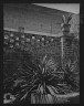 Arnold Genthe / Courtyard with plants and a brick wall, New Orleans / between 1920 and 1926