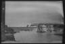 Arnold Genthe / Bridge partially extended over a body of water, Japan / 1908