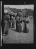 Arnold Genthe / Ainu woman outside in the village lane / 1908