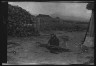 Arnold Genthe / Ainu man seated outside working on nets / 1908