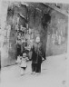 Arnold Genthe / Woman and a child walking down a street, Chinatown, San Francisco / between 1896 and 1906