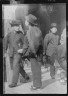 Arnold Genthe / Men standing or walking on a street, Chinatown, San Francisco / between 1896 and 1906