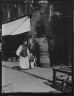 Arnold Genthe / In softly gaudy colors, Chinatown, San Francisco / between 1896 and 1906