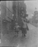 Arnold Genthe / In holiday dress, Chinatown, San Francisco / between 1896 and 1906