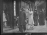 Arnold Genthe / Chinese and American women walking down a street, Chinatown, San Francisco / between 1896 and 1906