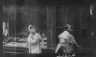 Arnold Genthe / Young girl walking down the street, looking into the camera, Chinatown, San Francisco / between 1896 and 1906