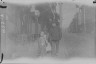 Arnold Genthe / Man and children walking down a street, Chinatown, San Francisco / between 1896 and 1906