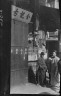 Arnold Genthe / Two men standing on a sidewalk, Chinatown, San Francisco / between 1896 and 1906