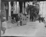 Arnold Genthe / Three children in front of a cellar door, Chinatown, San Francisco / between 1896 and 1906