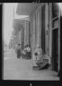 Arnold Genthe / View down a sidewalk, New Orleans / between 1920 and 1926