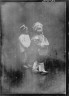 Arnold Genthe / Two children walking down the street, Chinatown, San Francisco / between 1896 and 1906