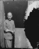 Arnold Genthe / The Chinese cook, grinning from the doorway, Chinatown, San Francisco / between 1896 and 1906