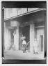 Arnold Genthe / On Chartres Street, formerly the main shopping thoroughfare, New Orleans / between 1920 and 1926