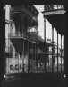 Arnold Genthe / Slender posts supporting the iron fretwork of galleries, New Orleans / between 1920 and 1926