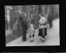 Arnold Genthe / Reading the Tong proclamation, Chinatown, San Francisco / between 1896 and 1942; from a photograph taken between 1896 and 1906