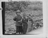 Arnold Genthe / Three Ainu children standing in a garden / between 1908 and 1942; from a negative taken in 1908