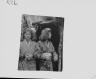 Arnold Genthe / Two Ainu women standing outside the entrance of a hut / between 1908 and 1942; from a negative taken in 1908