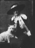 Arnold Genthe / Millholland, Inez (Mrs. Eugene Boissevain), with dog, portrait photograph / 1914